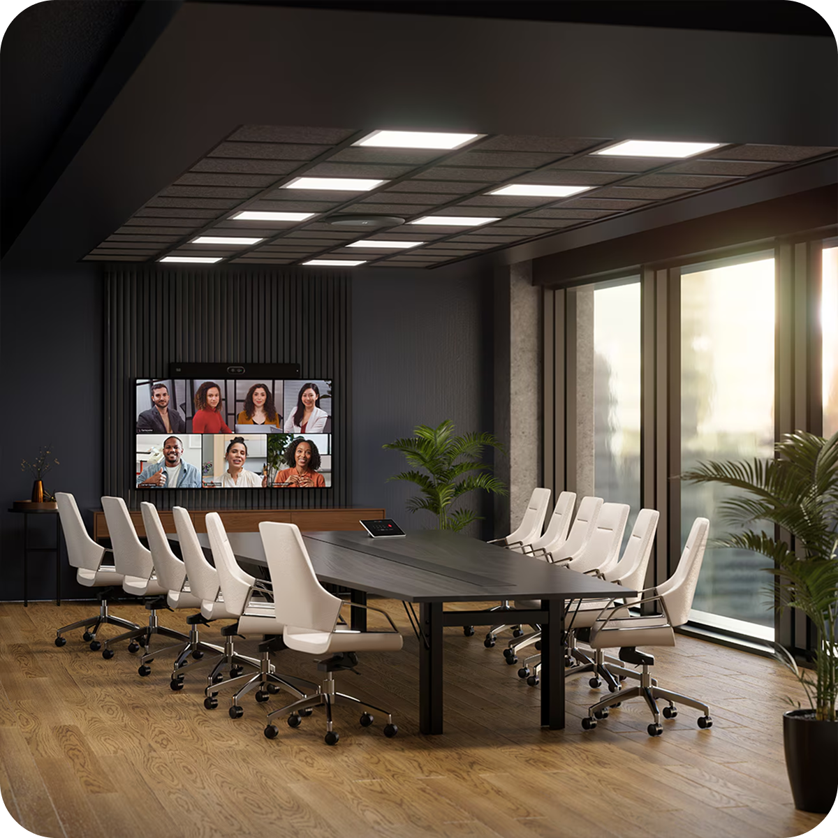 A conference room with a desk and chairs facing a large screen showing a Webex meeting in progress.